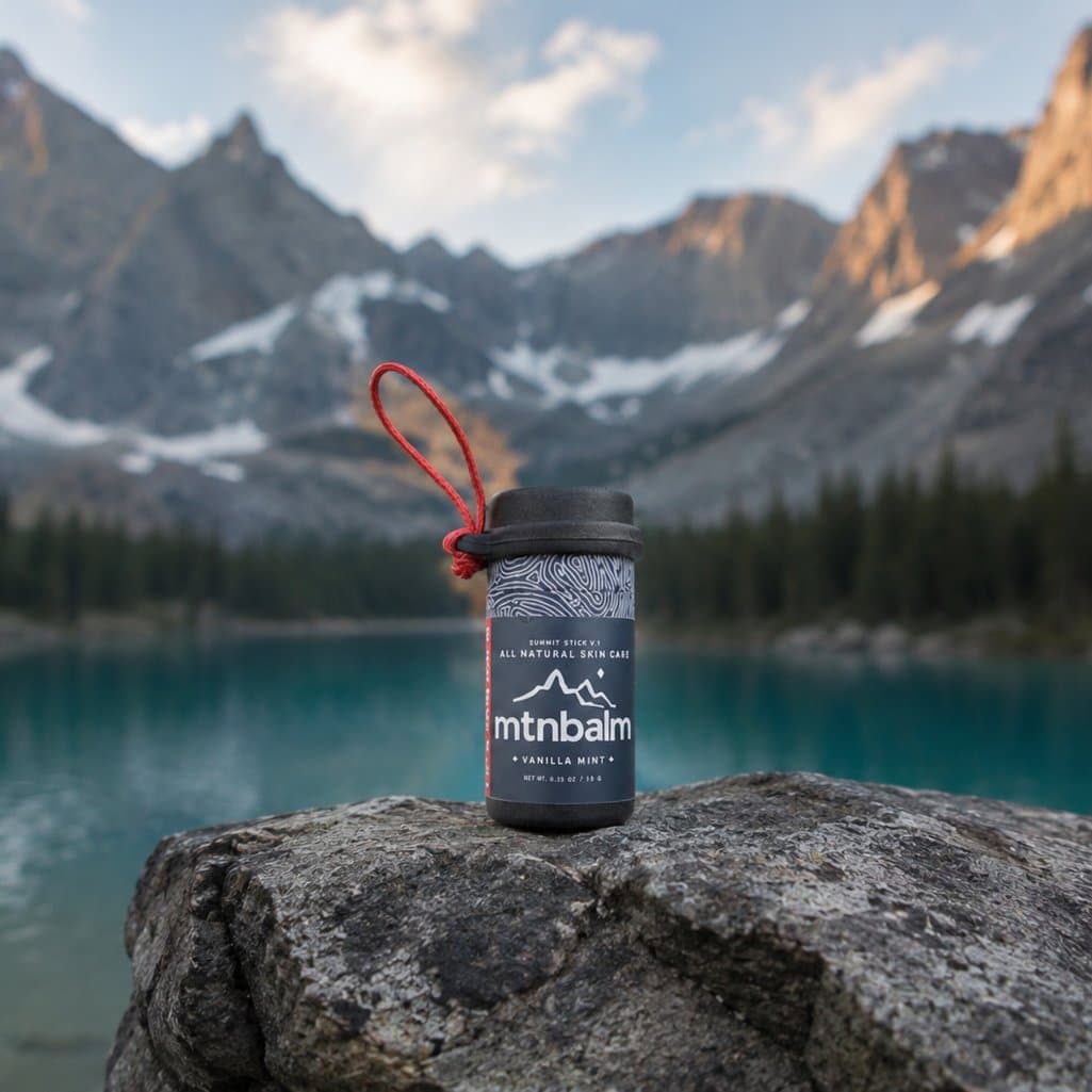 Summit Stick on a rock beside an alpine lake
